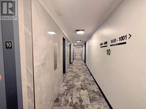 Toronto (Cabbagetown-South St. James Town) condo for rent - A long hallway with a sign that says REALTOR.