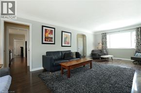 Burlington apartment for rent - A living room with a couch, coffee table, and two framed pictures on the wall.