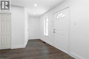 Burlington apartment for rent - A white door is on the left side of the room.