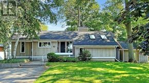 Orillia apartment for rent - A house with a lawn in front of it.