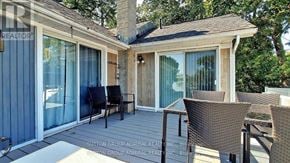 Orillia apartment for rent - A patio with chairs and a table is shown.