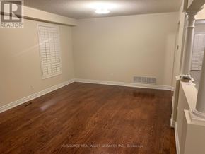 Mississauga (East Credit) apartment for rent - A room with wooden flooring and white walls.