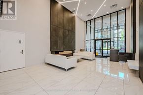 Hamilton (Central) condo for rent - A white reception area with a glass wall and a white bench.