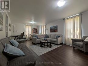 Belleville (Belleville Ward) apartment for rent - A living room with a grey couch and a coffee table.