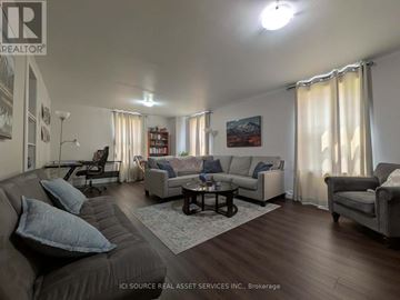 Belleville (Belleville Ward) apartment for rent - A living room with a grey couch and a coffee table.