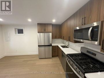 Toronto (University) apartment for rent - A kitchen with a stainless steel refrigerator, microwave, and oven.