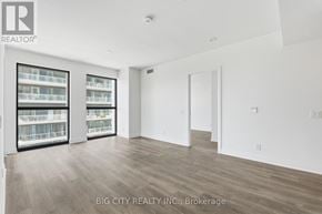 Toronto (Thorncliffe Park) condo for rent - A spacious room with wooden flooring and large windows.