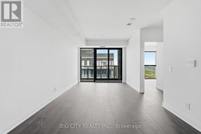 Toronto (Thorncliffe Park) condo for rent - A spacious room with a large window and a sliding door leading to a balcony.