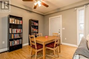 Bradford West Gwillimbury (Bradford) fourplex for rent - A room with a table, chairs, and bookshelves.