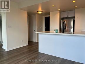 Toronto (Rosedale-Moore Park) condo for rent - A kitchen with a white counter and a refrigerator.