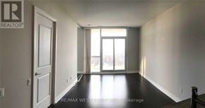 Toronto (Willowdale East) condo for rent - A room with a door and a window with a view of a balcony.