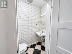 Toronto (Keelesdale-Eglinton West) apartment for rent - A white sink in a white tiled bathroom.