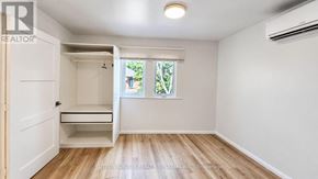 Toronto (Keelesdale-Eglinton West) apartment for rent - A room with a window and a door leading to a balcony.