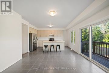 Loyalist (Bath) apartment for rent - A spacious kitchen with a dining table and chairs is shown in the image.