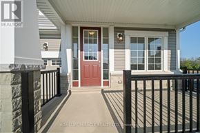 Loyalist (Bath) apartment for rent - A house with a red door and a black railing.