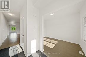 Loyalist (Bath) apartment for rent - A spacious room with a doorway leading to another room.
