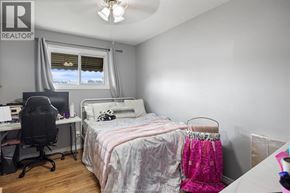 Lakeshore apartment for rent - A bedroom with a bed, desk, and chair.