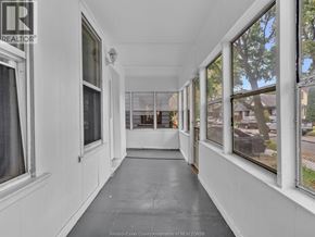 Windsor apartment for rent - A long hallway with windows on both sides.