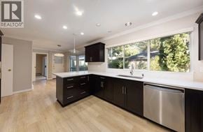 Vancouver apartment for rent - A modern kitchen with wooden floors and stainless steel appliances.