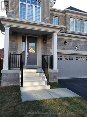 Oakville (Go Glenorchy) apartment for rent - A house with a grey front door and a black railing.