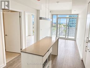 Toronto (Waterfront Communities) condo for rent - A kitchen with a view of the city.