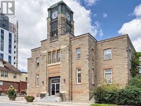Halton Hills (Georgetown) multi-family for rent - A large building with a clock tower is for sale.