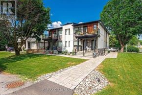 Ottawa apartment for rent - A modern house with a stone pathway leading to the front door.