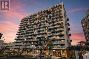 Richmond Hill condo for rent - A tall residential building with balconies and a sign that reads "CENTURY GENERATION".