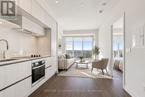 Richmond Hill condo for rent - A modern kitchen with a dining area in the background.