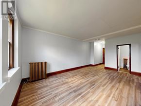 Halton Hills (Georgetown) multi-family for rent - A room with wooden floors and white walls.