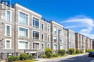 Markham (Cornell) townhouse for rent - A row of modern apartment buildings with balconies and windows.