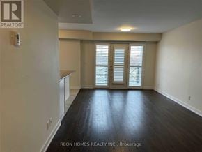 Markham (Cornell) townhouse for rent - A room with a window and wooden flooring.