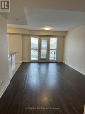 Markham (Cornell) townhouse for rent - A room with wooden floors and a window with blinds.