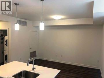 Kitchener townhouse for rent - A kitchen with a sink and a light fixture.