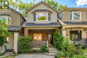 Toronto (Woodbine Corridor) apartment for rent - A house with a front porch and a small garden.