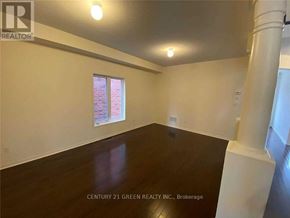 Brampton (Sandringham-Wellington) apartment for rent - A room with a window and a wooden floor is for sale.