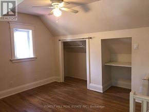 Toronto (Wychwood) apartment for rent - A room with a ceiling fan and a window.
