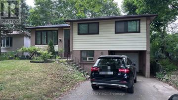 Markham (Royal Orchard) apartment for rent - A black SUV is parked in front of a two-story house.
