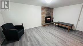 Markham (Royal Orchard) apartment for rent - A living room with a black chair and a fireplace.