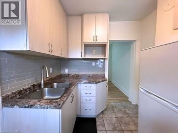 Hamilton apartment for rent - A kitchen with a sink and cabinets.