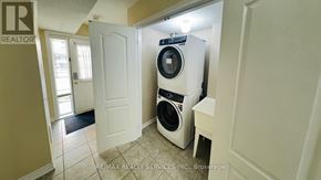 Brampton (Bram West) townhouse for rent - A white dryer is in a small room with a door open.
