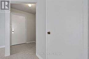 Burlington (Brant) multi-family for rent - A white door with a handle and a lock is in a room with white walls.
