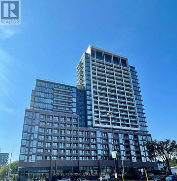 Mississauga (Port Credit) condo for rent - A tall building with a glass facade and a sign that reads "HOMELIFE Miracle" in front of it.