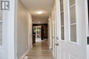 Woodstock (Woodstock - South) townhouse for rent - A hallway with white doors and a wooden floor.