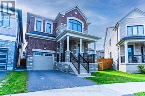Pickering apartment for rent - A large, two-story house with a garage is the focal point of the image.
