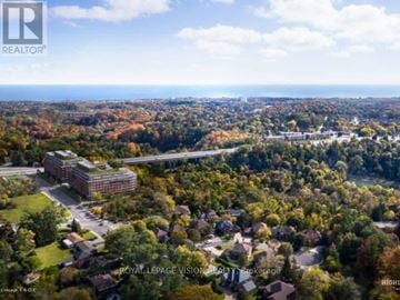 Toronto (Centennial Scarborough) condo for rent - A bird's eye view of a residential area with a large building in the center.