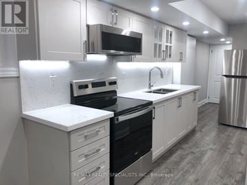Milton (Walker) apartment for rent - A modern kitchen with white cabinets and stainless steel appliances.