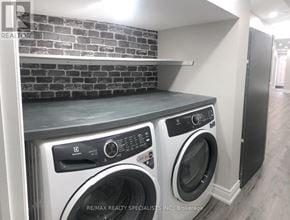 Milton (Walker) apartment for rent - A laundry room with a washer and dryer.