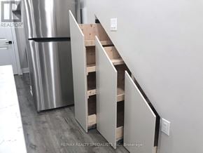Milton (Walker) apartment for rent - A kitchen with a stainless steel refrigerator and a wall-mounted oven.