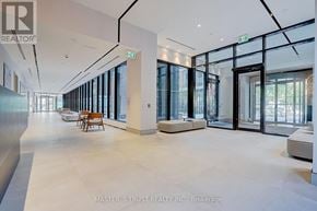 Toronto (North St. James Town) condo for rent - A spacious office lobby with glass walls and doors.
